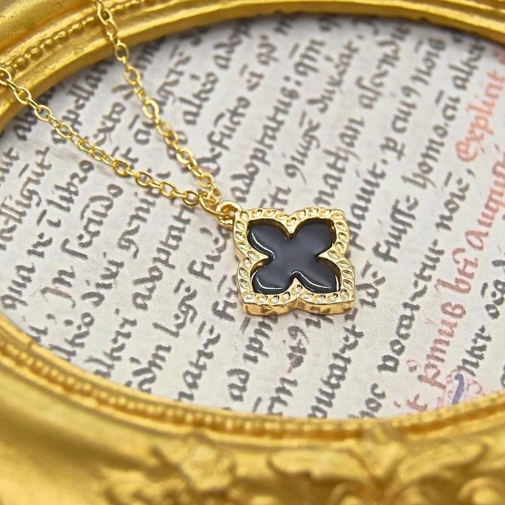 Gold Necklace with Black Clover Pendant